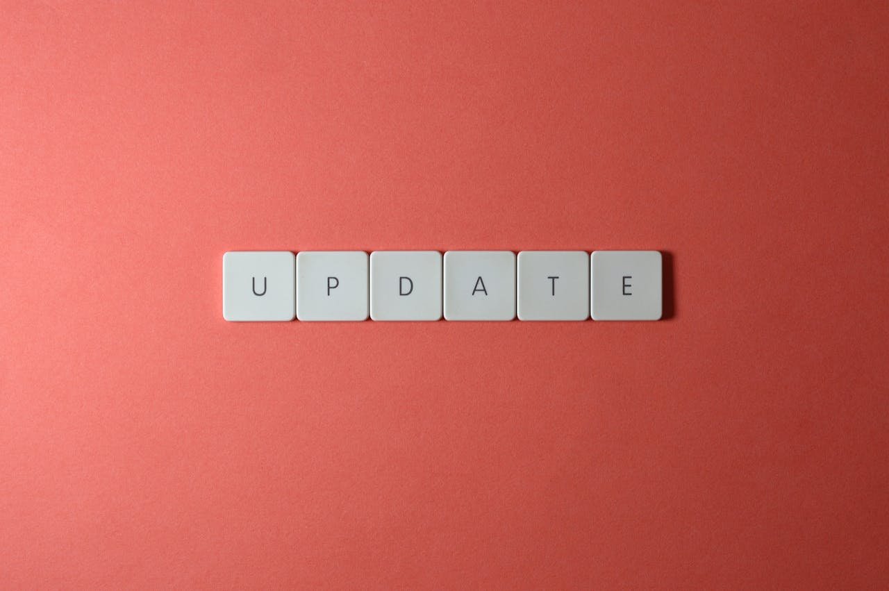 gallery-04 Keyboard keys arranged to spell 'update' on a vibrant red background, ideal for conveying tech concepts.